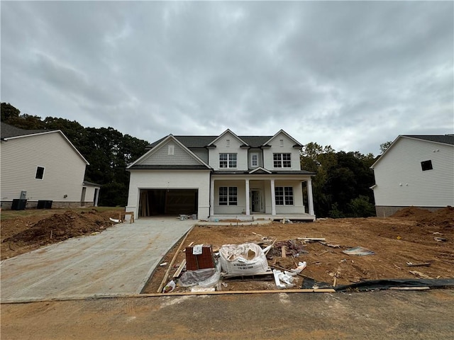 view of front of house featuring a porch and a garage