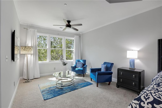 carpeted bedroom featuring baseboards, ornamental molding, and ceiling fan