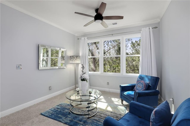 living area featuring carpet floors, ornamental molding, visible vents, and baseboards