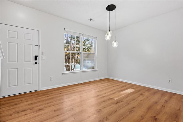 unfurnished dining area with light hardwood / wood-style floors