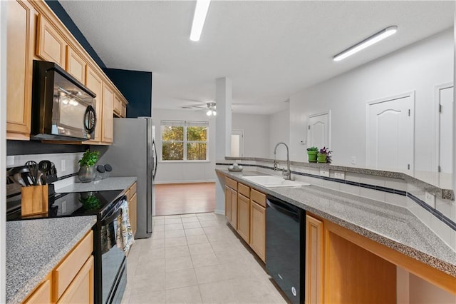 kitchen with light brown cabinetry, ceiling fan, sink, black appliances, and light tile patterned floors