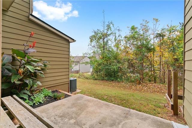 view of yard with a patio area and central AC