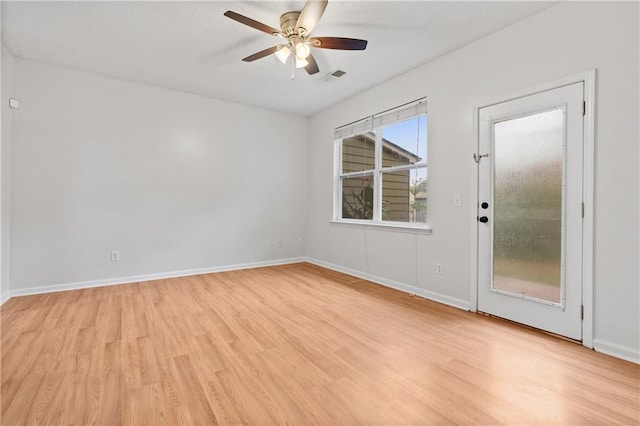 empty room featuring ceiling fan and light wood-type flooring