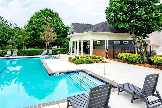 view of pool featuring a patio