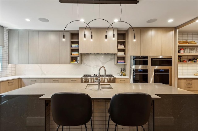 kitchen with double oven, modern cabinets, a sink, and open shelves