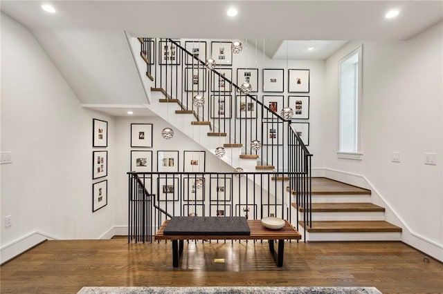 stairs featuring recessed lighting, baseboards, and wood finished floors