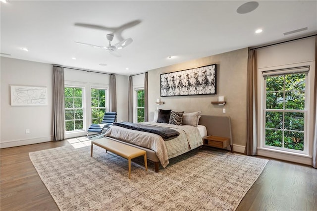 bedroom featuring recessed lighting, wood finished floors, a ceiling fan, and baseboards