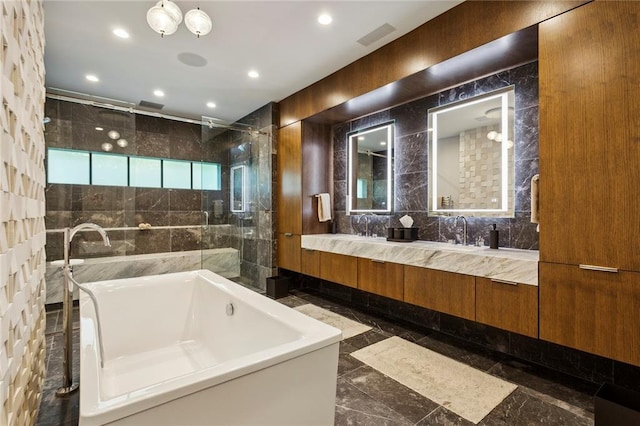 bathroom featuring a tub to relax in, tile walls, recessed lighting, visible vents, and a shower stall