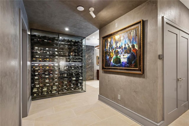 wine room with tile patterned flooring