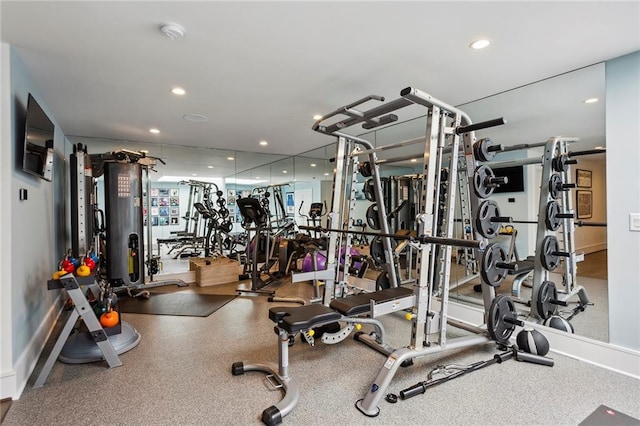 workout area with recessed lighting