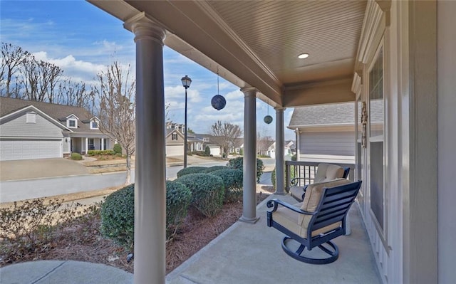 view of patio with covered porch and a residential view