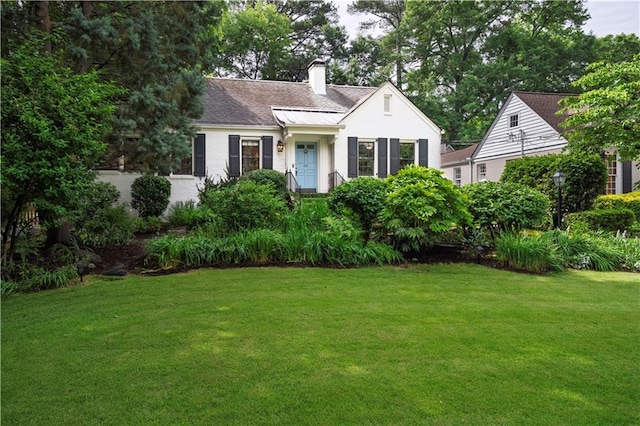 657 E Paces Ferry Rd NE, Atlanta, GA 30305 - view of front of home with a front yard, a chimney, and roof with shingles