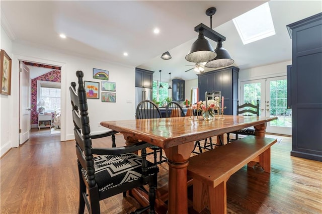 657 E Paces Ferry Rd NE, Atlanta, GA 30305 - dining area featuring a skylight, light wood-style floors, french doors, lofted ceiling, and ornamental molding