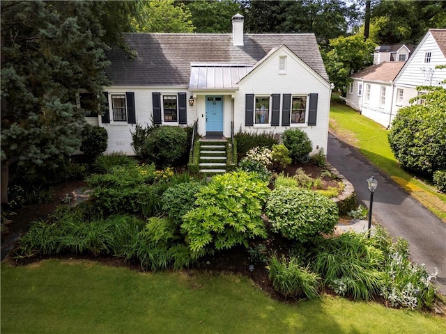 657 E Paces Ferry Rd NE, Atlanta, GA 30305 - view of front of home featuring brick siding, a shingled roof, and a chimney