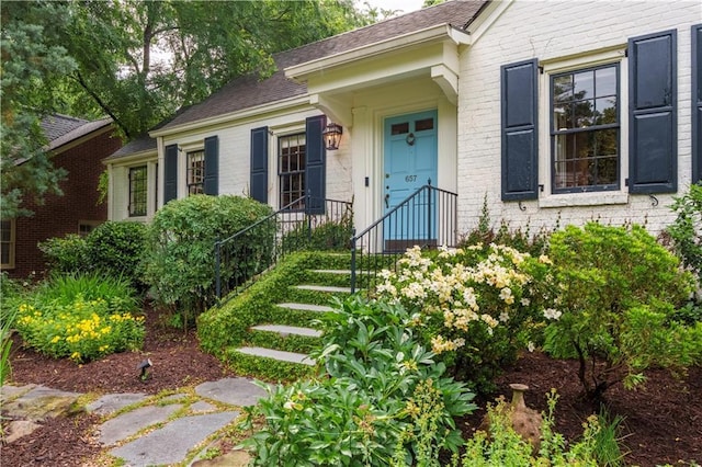 657 E Paces Ferry Rd NE, Atlanta, GA 30305 - view of exterior entry featuring brick siding and roof with shingles