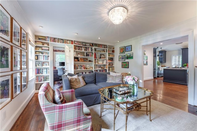 657 E Paces Ferry Rd NE, Atlanta, GA 30305 - living area featuring crown molding, wood finished floors, a chandelier, and built in shelves