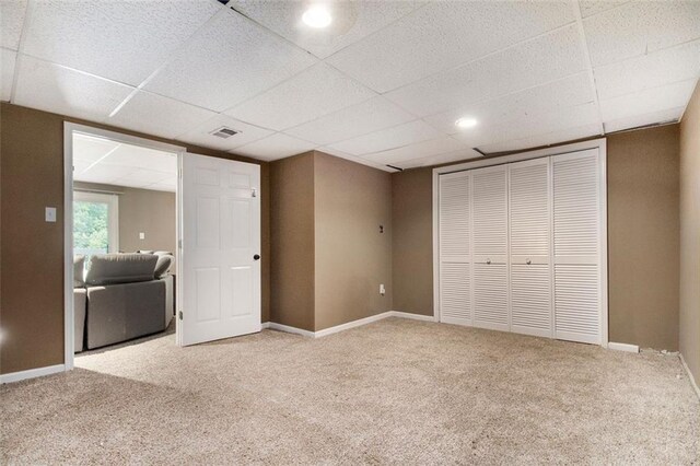 1452 Crooked Tree Cir, Stone Mountain, GA 30088 - unfurnished bedroom with a paneled ceiling, carpet flooring, and a closet