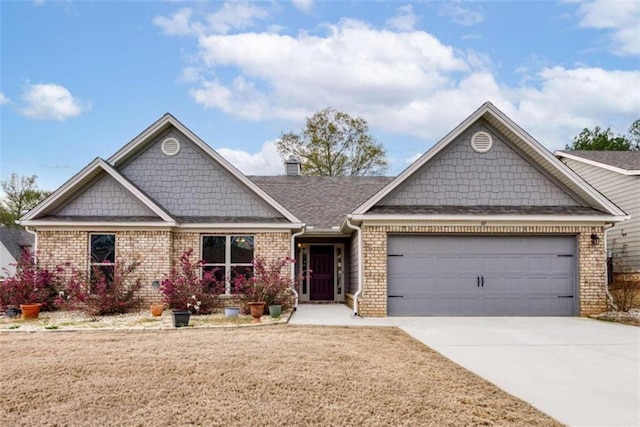 craftsman-style home with a garage, concrete driveway, a chimney, a front lawn, and brick siding