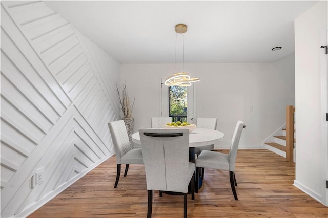 dining space featuring light hardwood / wood-style floors