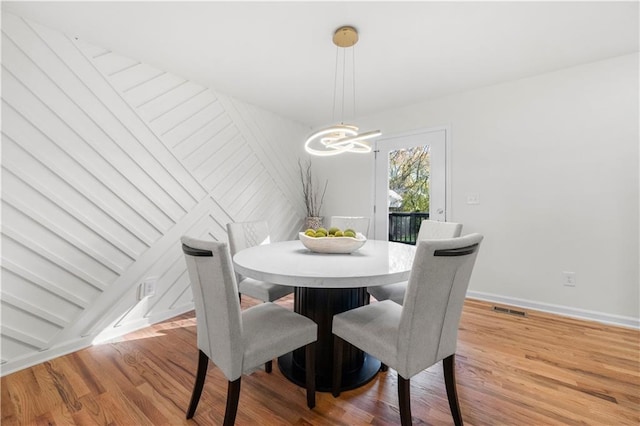 dining area with wood-type flooring