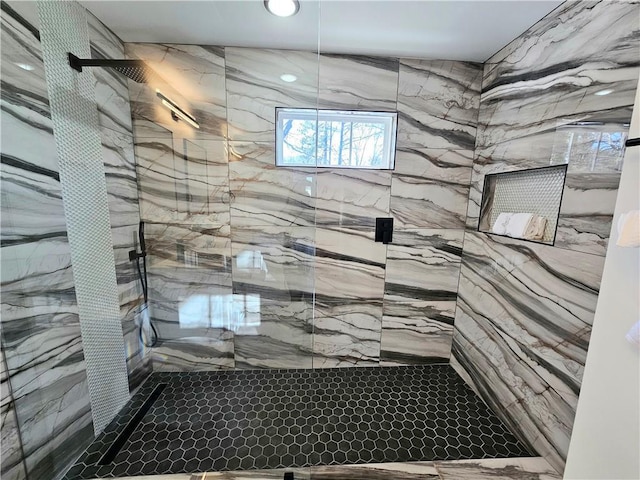 bathroom with tiled shower