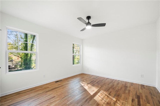 unfurnished room with ceiling fan and light hardwood / wood-style flooring