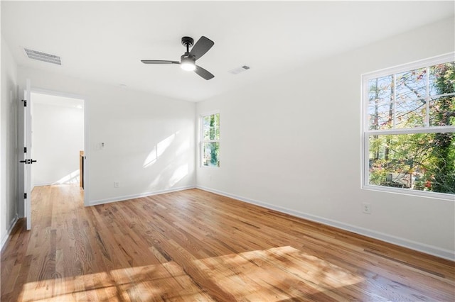 unfurnished room with ceiling fan and light hardwood / wood-style floors