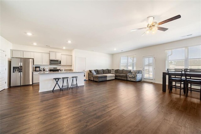 2030 Vidalia Ct, Dacula, GA 30019 - living area with dark wood-style flooring, recessed lighting, visible vents, a ceiling fan, and baseboards