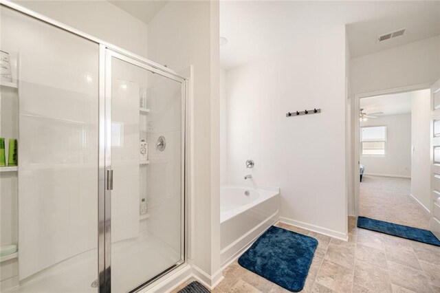 2030 Vidalia Ct, Dacula, GA 30019 - full bath with a stall shower, a garden tub, visible vents, and baseboards