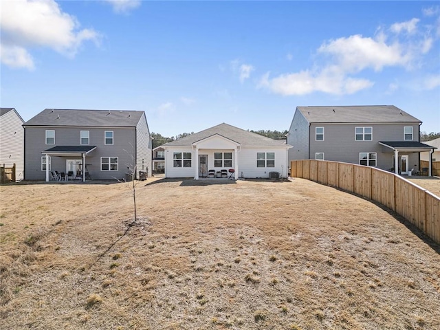 back of house featuring a patio area and fence