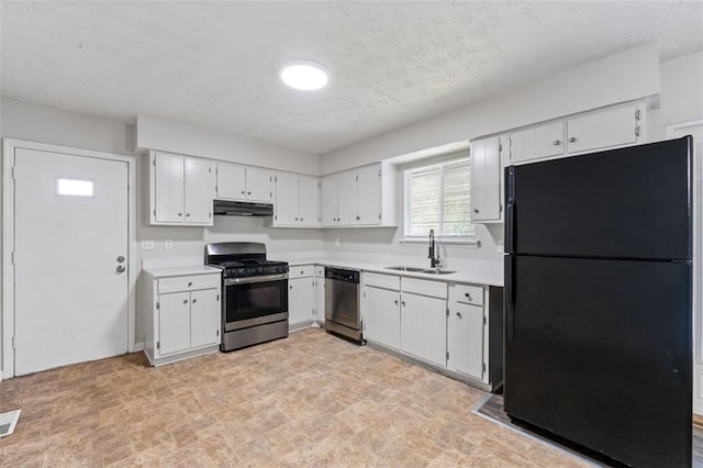 kitchen featuring white cabinetry, sink, a textured ceiling, and appliances with stainless steel finishes