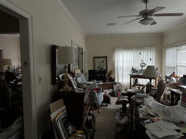 miscellaneous room with ornamental molding, ceiling fan, and carpet floors