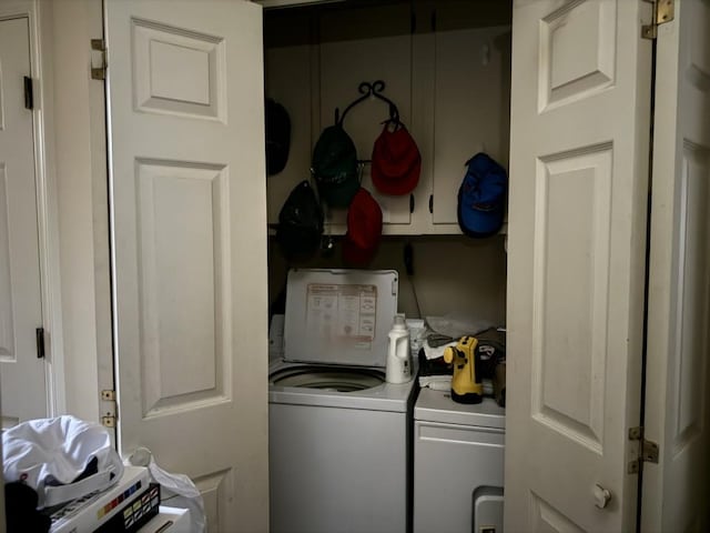 clothes washing area featuring independent washer and dryer