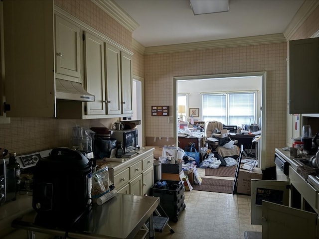 kitchen featuring cream cabinets and crown molding