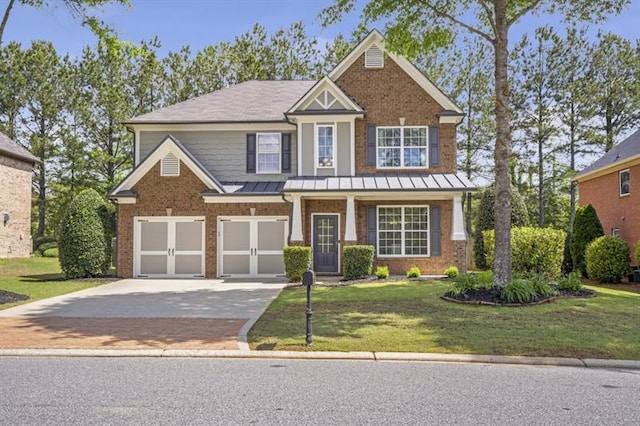 4765 Silver Leaf Dr, Cumming, GA 30040 - view of front of property with driveway, a standing seam roof, a front yard, and a garage