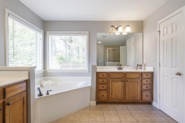 4765 Silver Leaf Dr, Cumming, GA 30040 - full bath with vanity, a stall shower, a garden tub, and tile patterned flooring