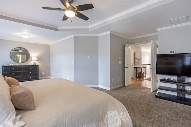 4765 Silver Leaf Dr, Cumming, GA 30040 - carpeted bedroom with ornamental molding, a raised ceiling, and a ceiling fan