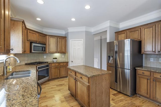 4765 Silver Leaf Dr, Cumming, GA 30040 - kitchen featuring appliances with stainless steel finishes, brown cabinetry, light wood-style floors, crown molding, and recessed lighting