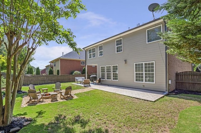 4765 Silver Leaf Dr, Cumming, GA 30040 - back of property featuring an outdoor fire pit and a patio area
