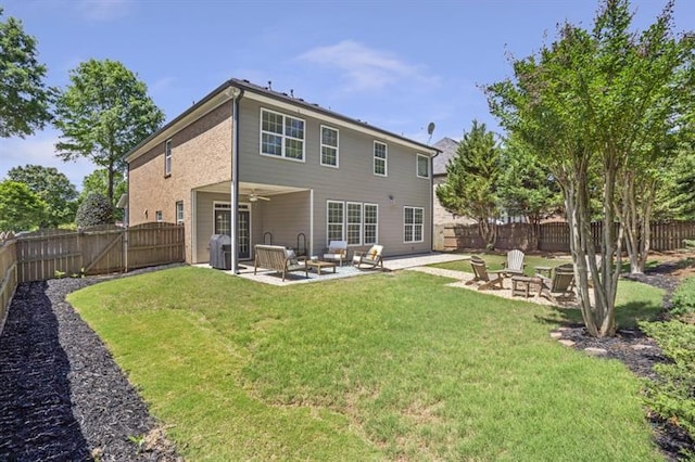 4765 Silver Leaf Dr, Cumming, GA 30040 - rear view of property featuring a patio, a fenced backyard, ceiling fan, and an outdoor living space with a fire pit