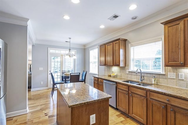 4765 Silver Leaf Dr, Cumming, GA 30040 - kitchen featuring dishwasher, brown cabinets, stone countertops, ornamental molding, and recessed lighting