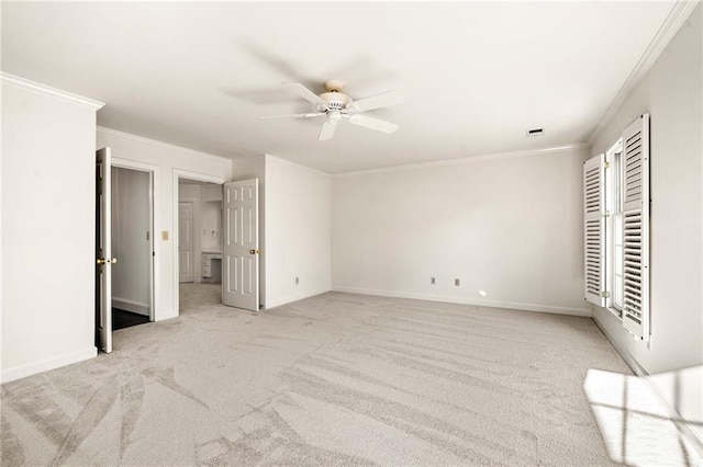 unfurnished bedroom with a ceiling fan, baseboards, ornamental molding, and carpet