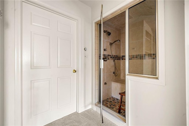 full bath featuring a shower stall