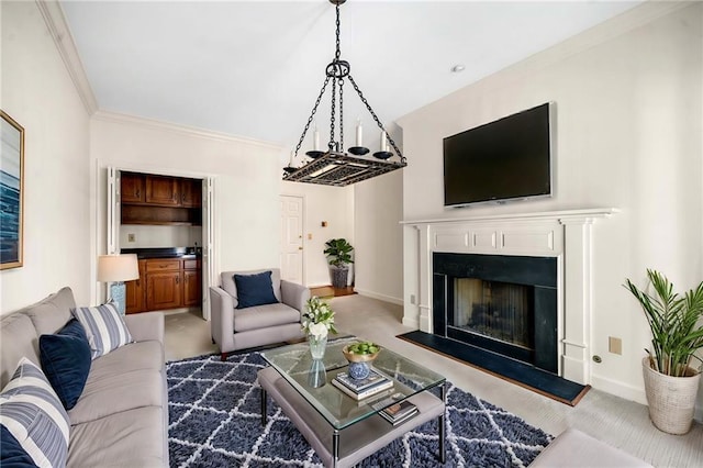 living area featuring baseboards, carpet flooring, a fireplace with raised hearth, and ornamental molding