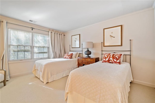 bedroom featuring visible vents, carpet flooring, baseboards, and ornamental molding