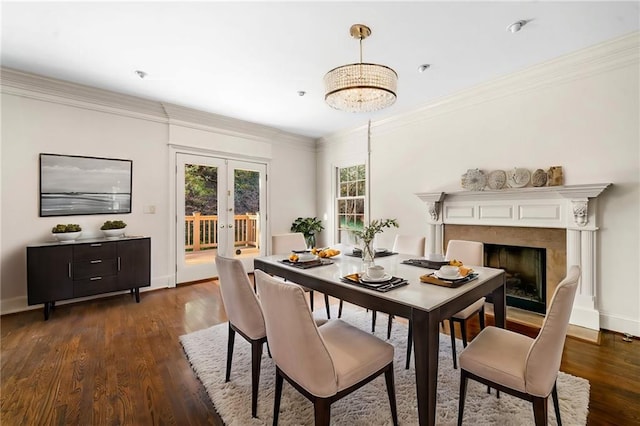 dining space featuring a high end fireplace, french doors, baseboards, ornamental molding, and dark wood-type flooring