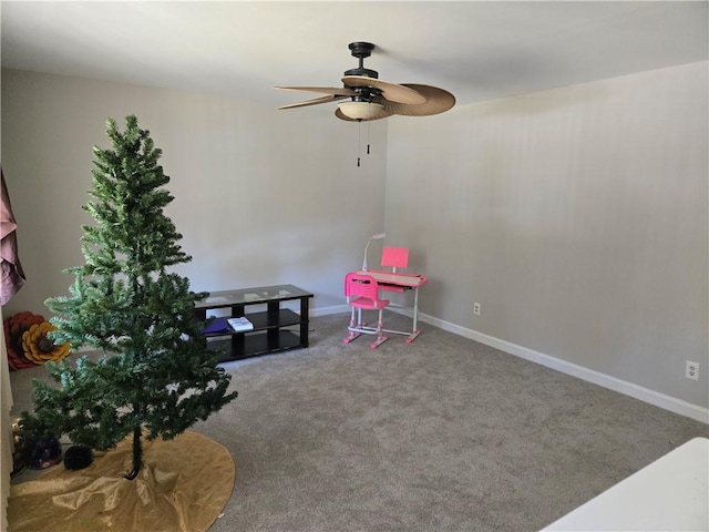 recreation room with ceiling fan and carpet floors