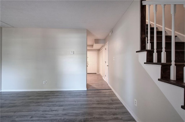 331 Leafmore Rd SW, Rome, GA 30165 - corridor with wood finished floors, stairs, baseboards, and a textured ceiling