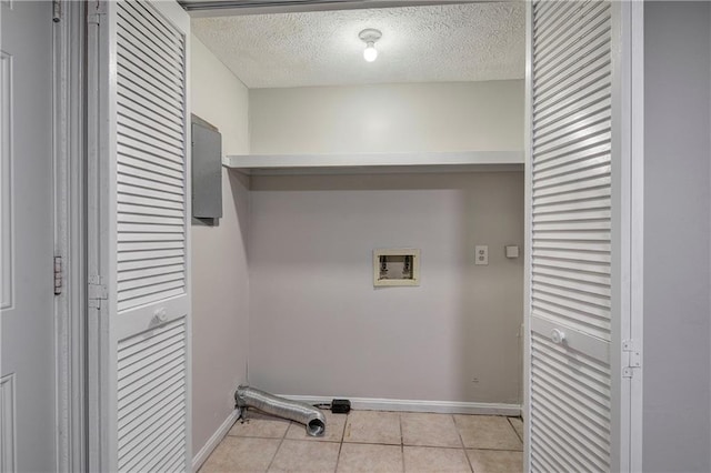 331 Leafmore Rd SW, Rome, GA 30165 - laundry room featuring washer hookup, baseboards, a textured ceiling, and light tile patterned floors