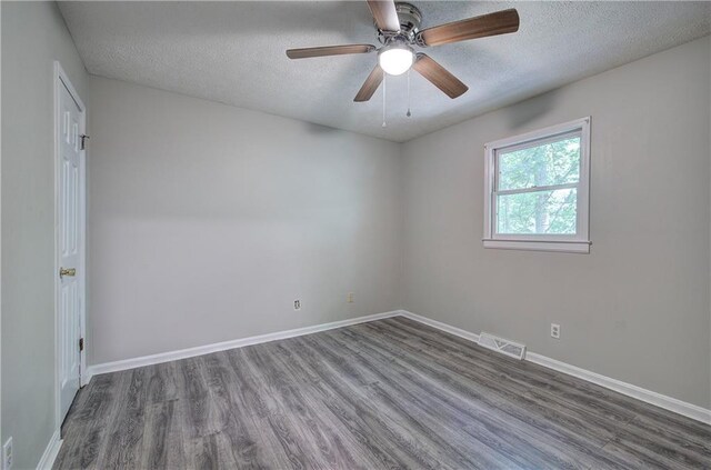 331 Leafmore Rd SW, Rome, GA 30165 - spare room featuring a textured ceiling, wood finished floors, baseboards, and a ceiling fan